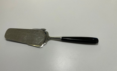 Vintage kakkulapio, teräs ja musta bakeliitti