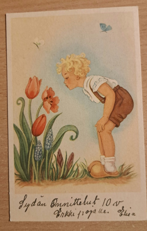 lapsi haistelee kukkaa, kulkenut 1949, joulumerkki