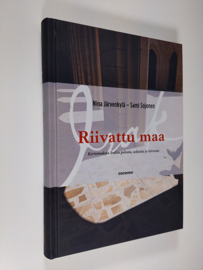 Nina Järvenkylä : Riivattu maa : kertomuksia Irakin pelos...