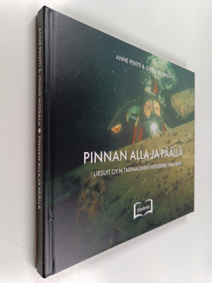 Pinnan alla ja päällä : Ursuit Oy:n tarinallinen historii...