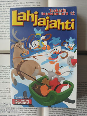 Aku Ankan taskukirja • teemanumero 12: Lahjajahti