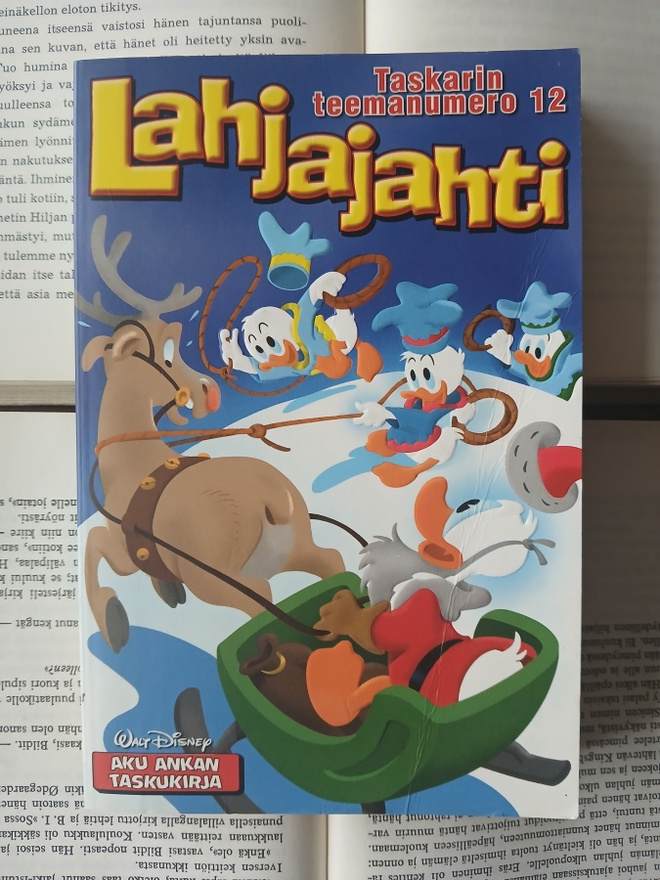 Aku Ankan taskukirja • teemanumero 12: Lahjajahti