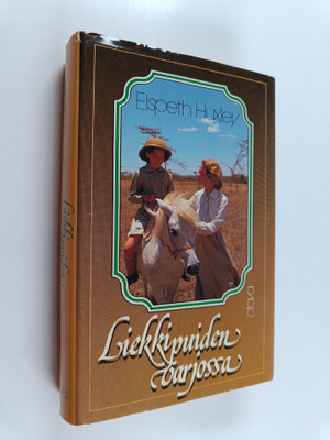 Elspeth Huxley : Liekkipuiden varjossa : muistoja lapsuud...