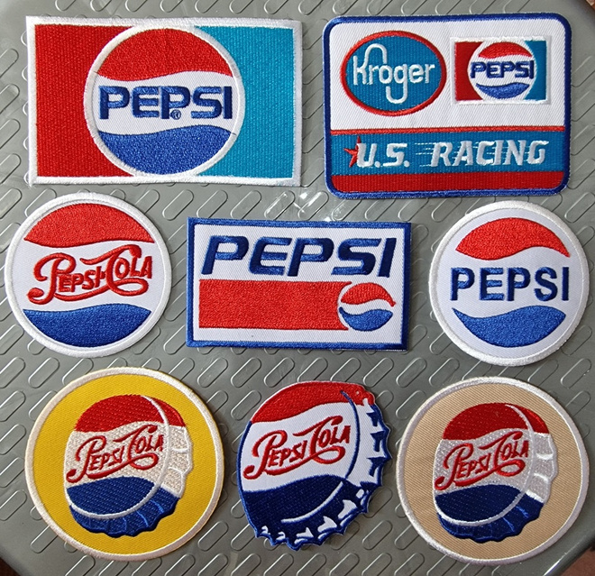 8 kpl erilaisia PEPSI COLA kangasmerkkejä