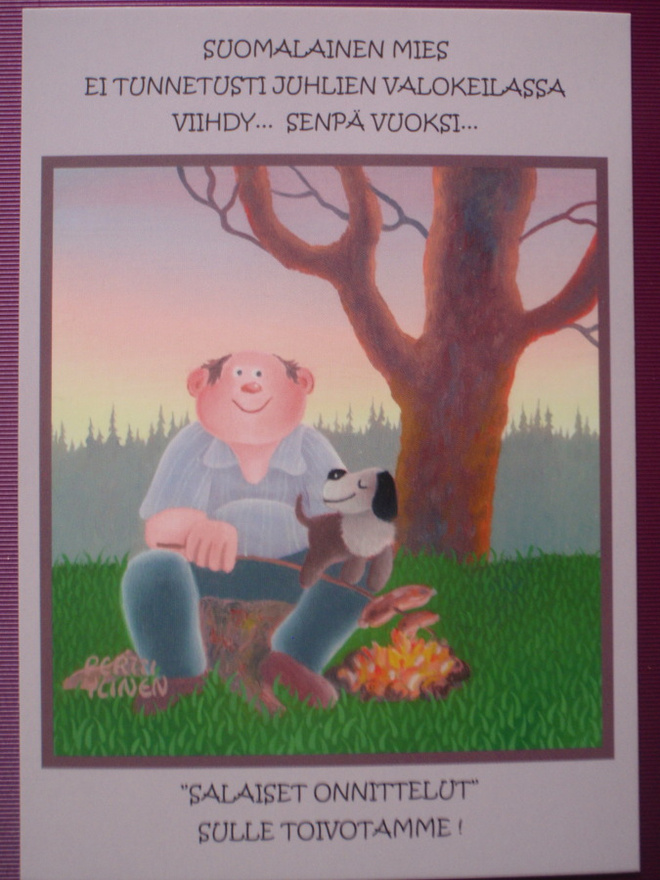 Pertti Ylinen mies ja koira makkaraa paistamassa nuotiolla