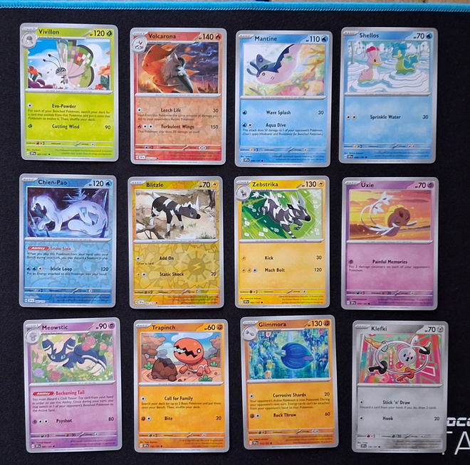 Pokemon kortit 12kpl (#107 Surging Sparks)