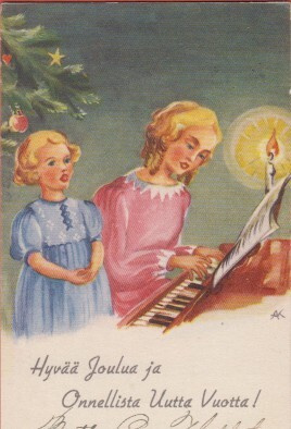 Airi Kari Äiti soittaa pianoa, lapsi laulaa vierellä