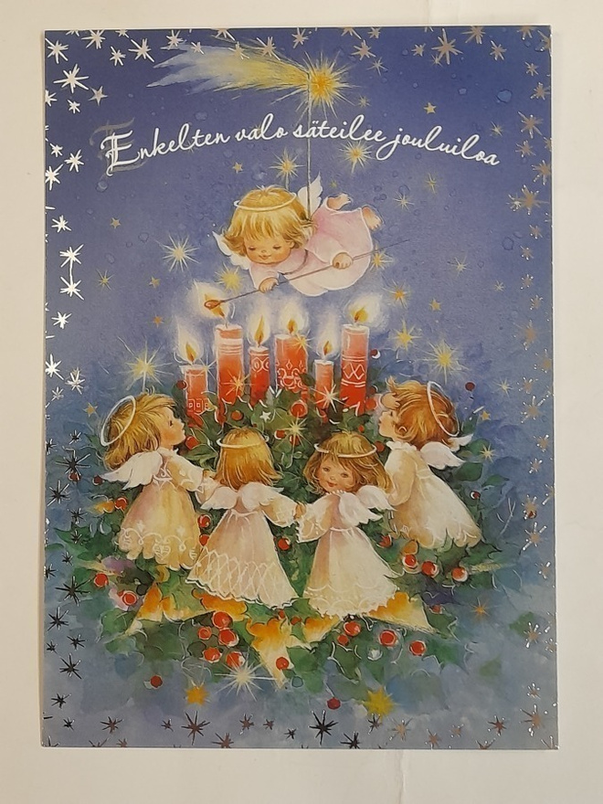 Enkelten valo säteilee jouluiloa
