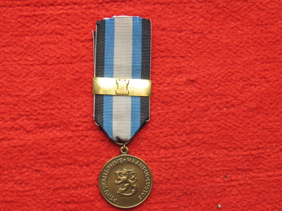Maanpuolustusmitali soljella