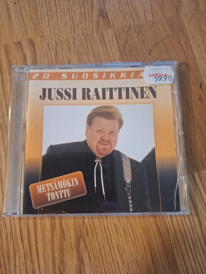 Jussi Raittinen-20 Suosikkia-Metsämökin Tonttu