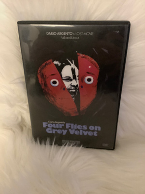 FOUR FLIES ON GREY VELVET