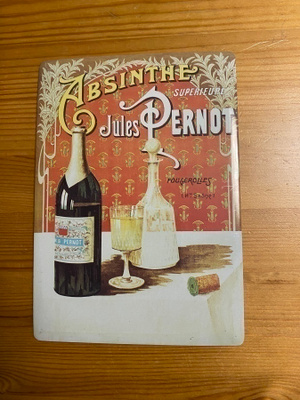 Absinthe peltitaulu ja Kwak-postikortti