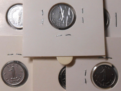 France. 1 centime, 7 erilaista kolikkoa.