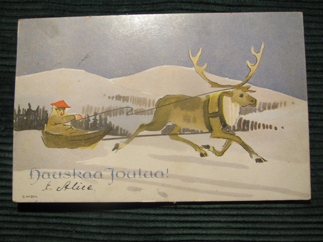Hauskaa Joulua!  Poro vetää ahkiota. Postikortti.