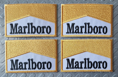 4 kpl Marlboro Gold kangasmerkkejä 8e/setti tai 2.5e/kpl.