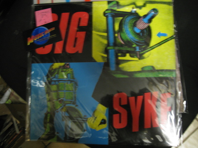 SIG - SYKE -M-/M- LP 1.PAINOS 1983