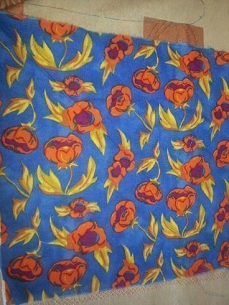 Oranssit kukat sinisellä tilkkutyökangas 26x26cm x 3