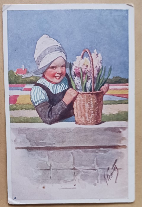 K. Feiertag: Nuori leidi ja kori hyasintteja muurilla p 1927