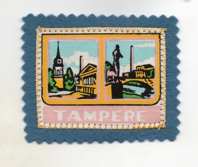 Tamåere: Matkailu /hihamerkki  (kangasta)