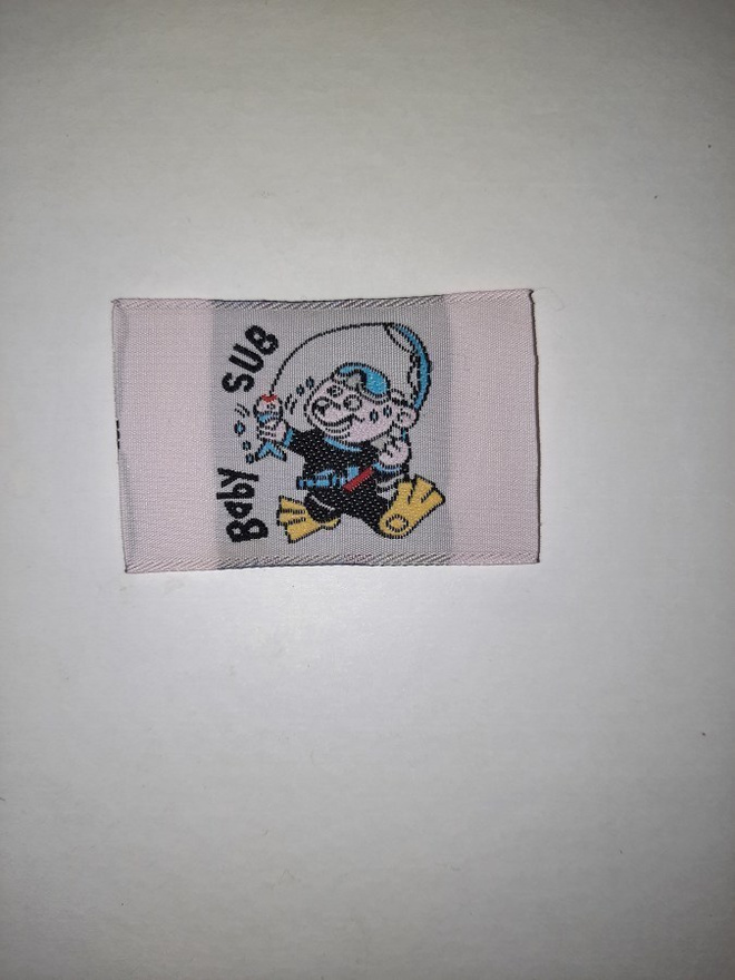 Silitettävä kangasmerkki 16
