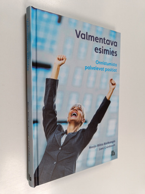 Leni Grunbaum ym. : Valmentava esimies : onnistumista pal...