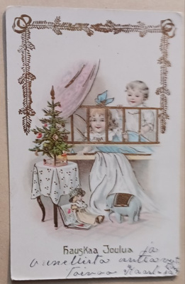 Lapset katsovat vuoteesta joulukuusta ja lahjoja, p. 1913