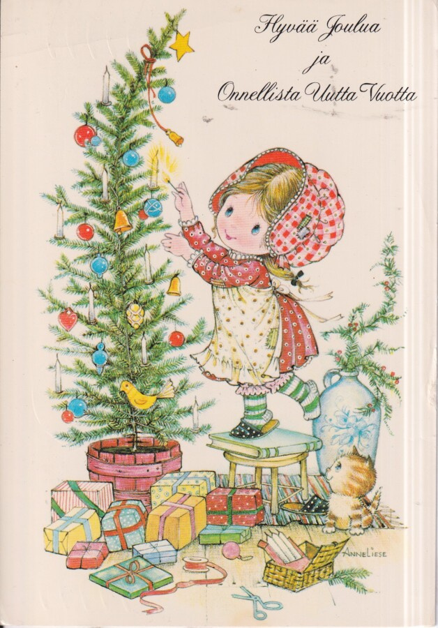 Anne Liese. Tyttö koristelee kuusta.  e164