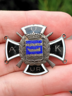AUK-merkki hopeaa