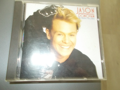 CD JASON DONOVAN ** BETWEEN THE LINES **