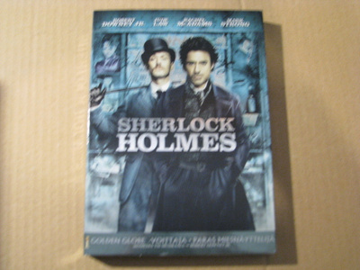 SHERLOCK HOLMES ( Robert Downey JR. )