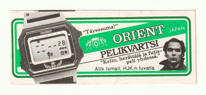 Kellomainostarra Orient Pelikvartsi