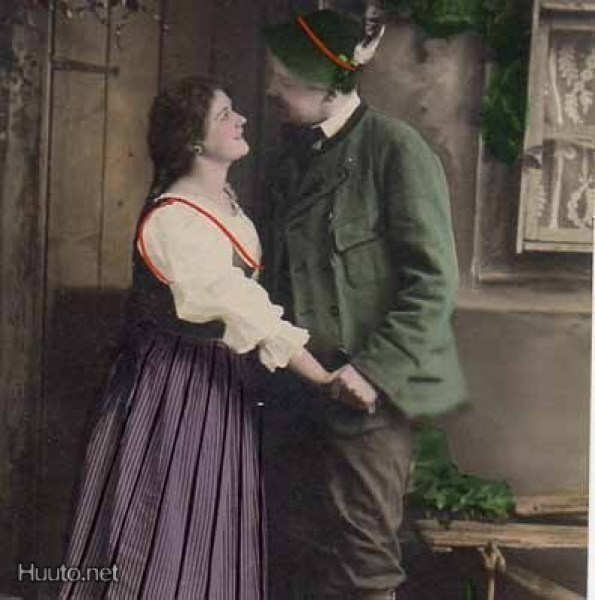 RAKKAUS / Mies pitää tytön käsiä omissaan ovella. 1900-l.