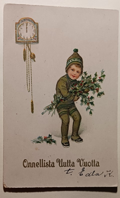 Lapsi ja kimppu rautatammen lehviä, kello, p. 1924