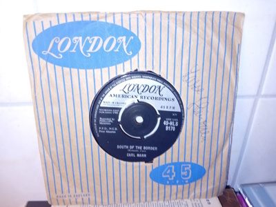 7" single Carl Mann : South of the Border ( SIS POSTIKULU  )