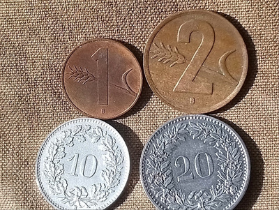 Sveitsi Helvetica kolikot - 1, 2 , 10 , 20. Hyväkuntoiset.