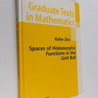 Kehe Zhu : Spaces of holomorphic functions in the unit ball - pikkukuva 1