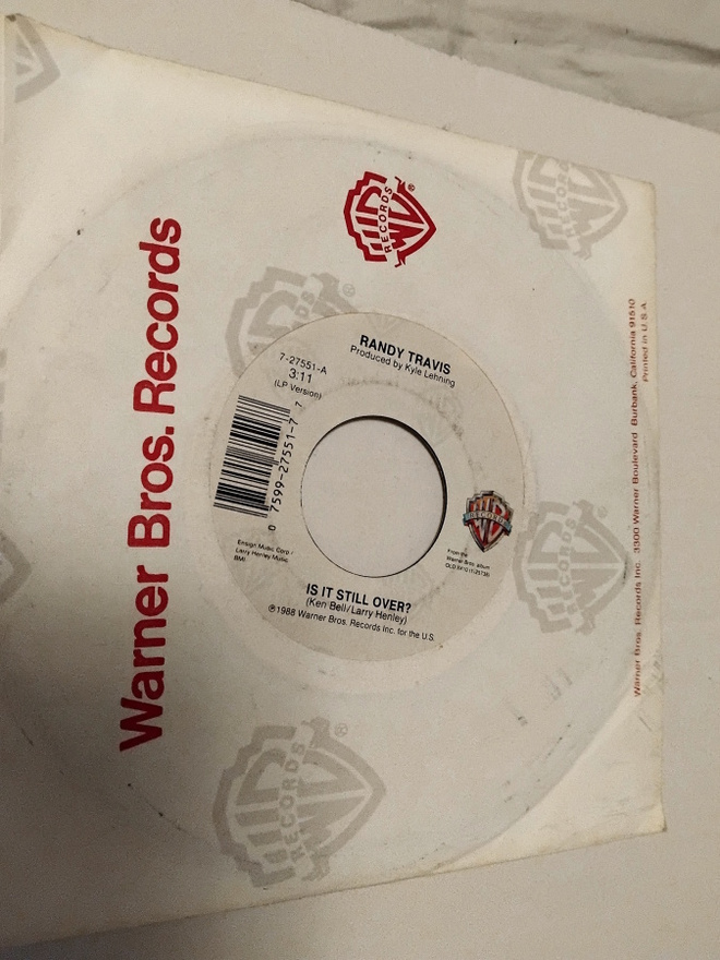Randy Travis - Is It Still Over  7'' vinyylisinkku