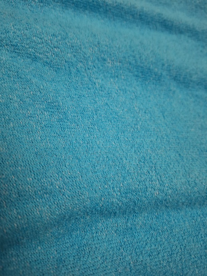 Muotoiltu lakana kuminauhalla Anttila