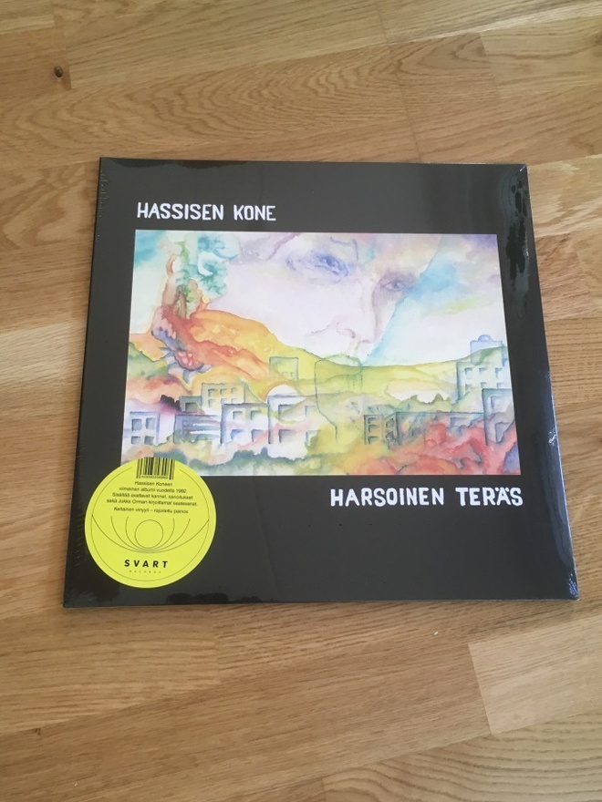 Hassisen kone – Harsoinen teräs LP (keltainen, Svart)