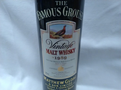 The Famous Grouse tyhjä peltipurkki