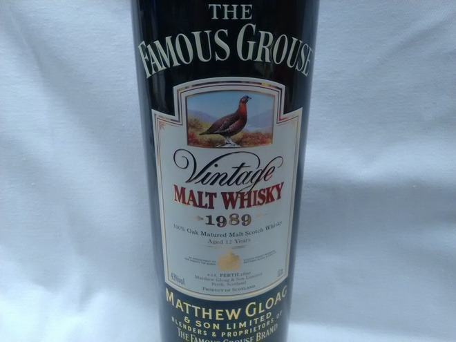 The Famous Grouse tyhjä peltipurkki