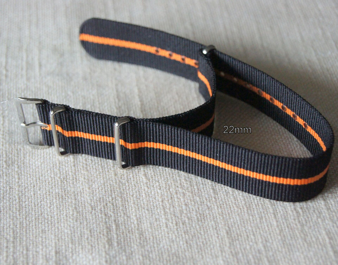 Nato 22mm musta kapealla oranssi raidalla