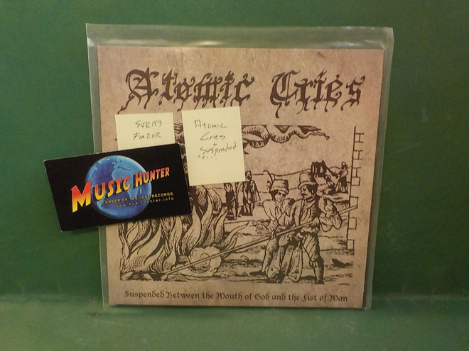 ATOMIC CRIES - SUSPENDED BETWEEN THE MOUTH OF GOD .. 7"