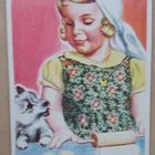 Tyttö leipoo koiranpennun katsellessa, ei p. - pikkukuva 1