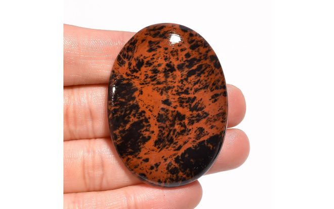 "Punainen" obsidiaani 84.19 karaattia cabochon 48x35x7 mm