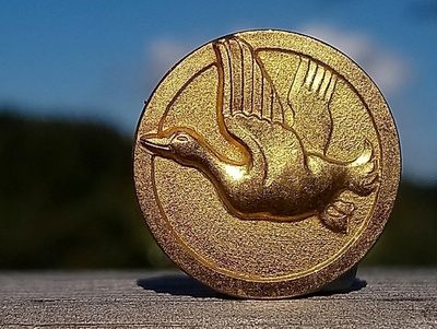 Kullanvärinen metsästys merkki. Halkaisija - 21 mm.
