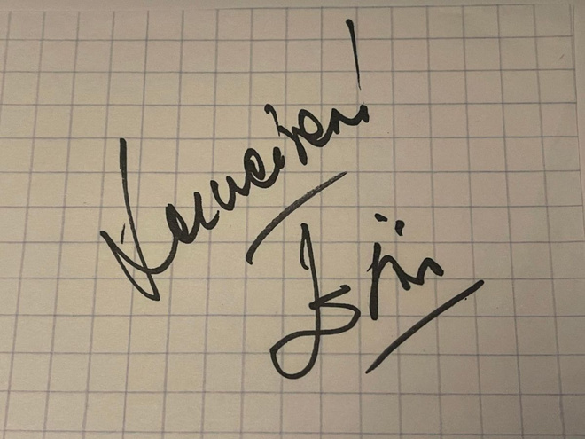 Eini nimikirjoitus paperilla