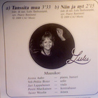 LULU :: TANSSITA MUA / NIIN JA NYT :: VINYYLI 7" 1989 - pikkukuva 2