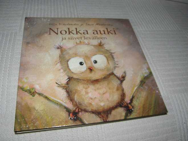 Kauhanen - Mustonen Nokka auki ja siivet levälleen