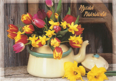 Kukat emalipannussa. Hyvää Pääsiäistä